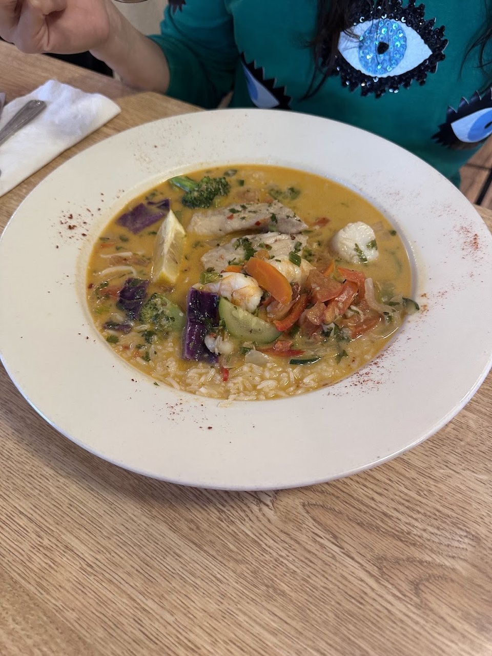 Printed menu showing seafood and Latin dishes.